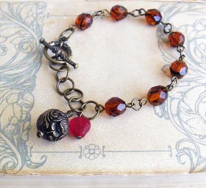 Heirloom Tulips: a vintage-inspired charm bracelet in antiqued brass and amber glass – one of a kind